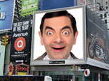 Photomontage, a staff of an urban environment, with an advertising screen, among