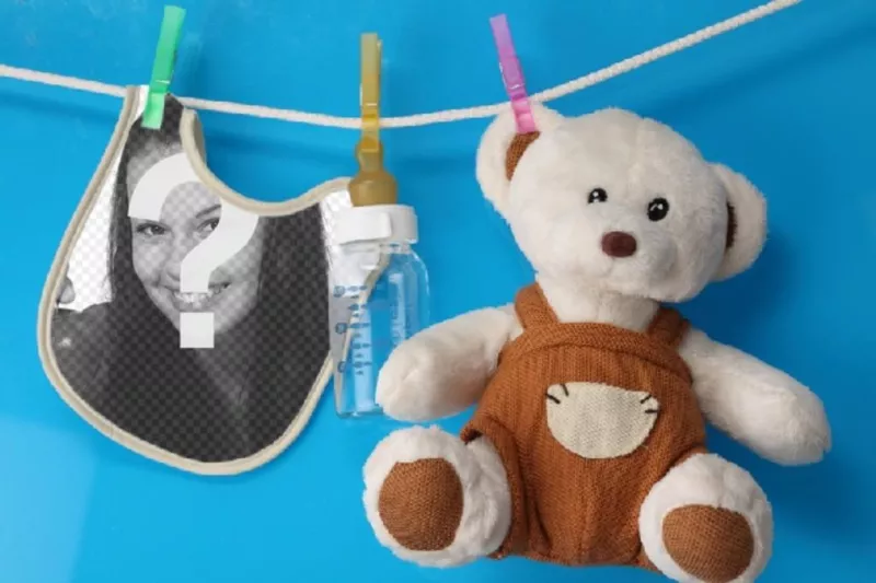 Collage with a bib and a teddy bear where you can place a picture of a new born on a blue..