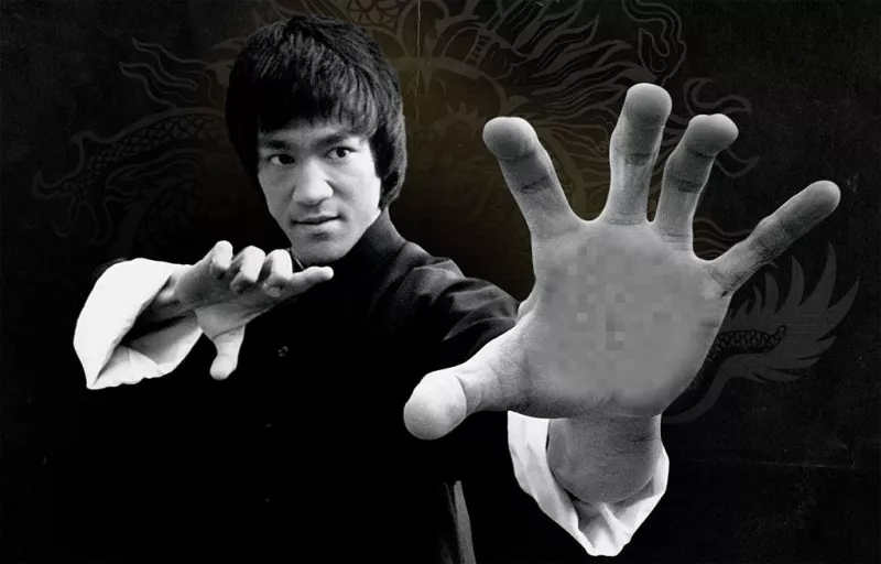 Your photo in the hand of Bruce Lee making a karate pose ..
