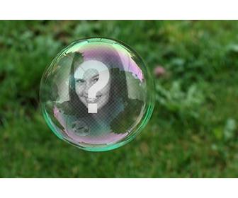 photomontage with soap bubble on background of green grass where ur photo will appear reflected inside the bubble