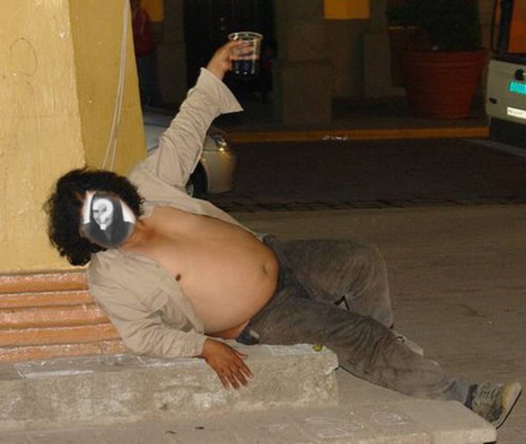 Photomontage of a drunk fat man lying on the ground where you can place the face of anyone you want and add some..