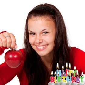 Birthday postcard with lighted candles on a cake