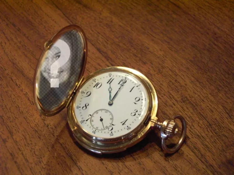 Photomontage with a pocket watch on a wooden table where you can put your photo on the golden..