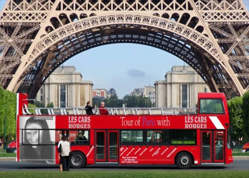 Insert your photo in a poster advertising a tour bus under the Eiffel Tower in..